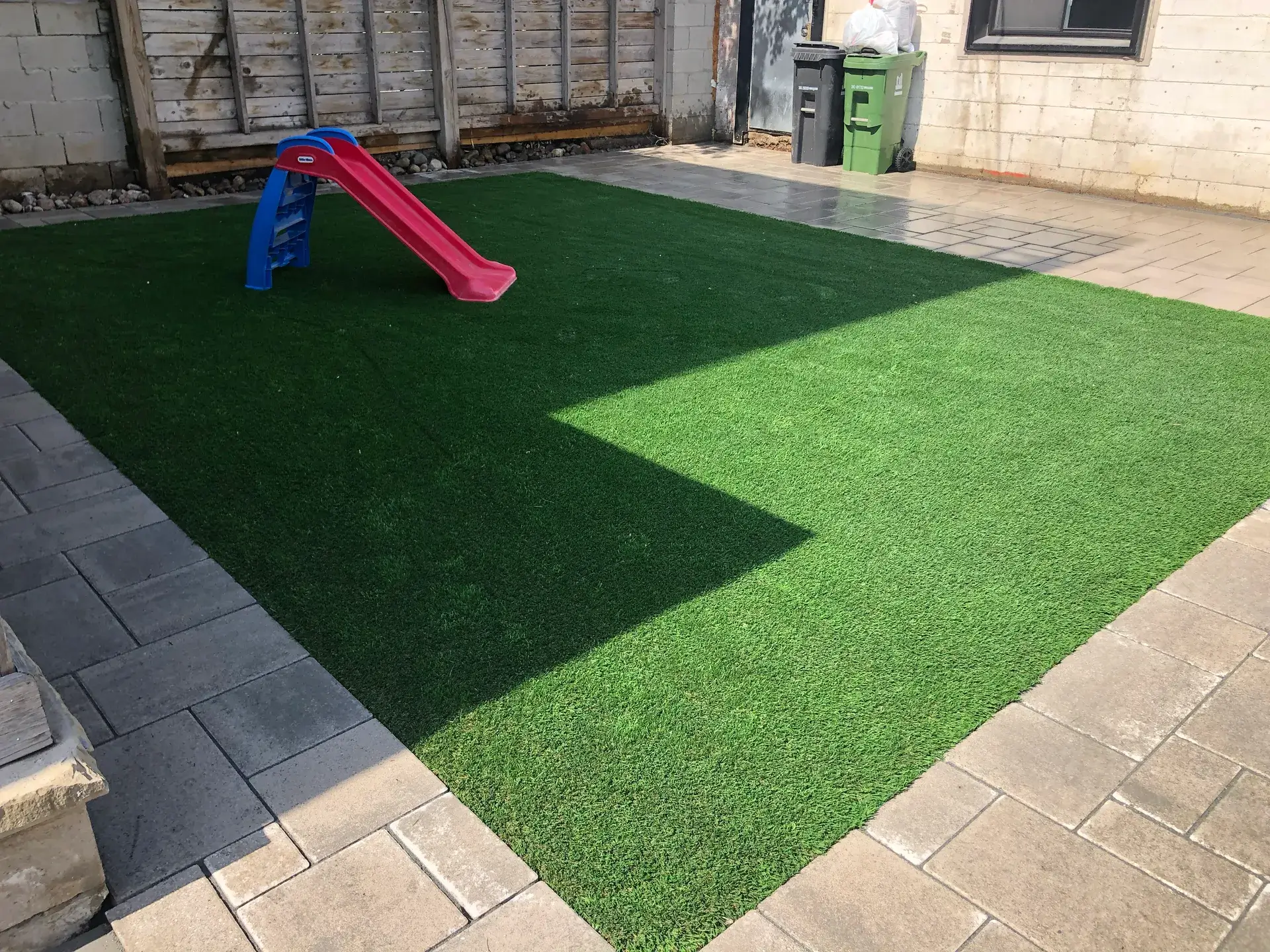 Artificial turf landscaping by UltraScape for Toronto GTA homes and businesses with a durable green lawn finish