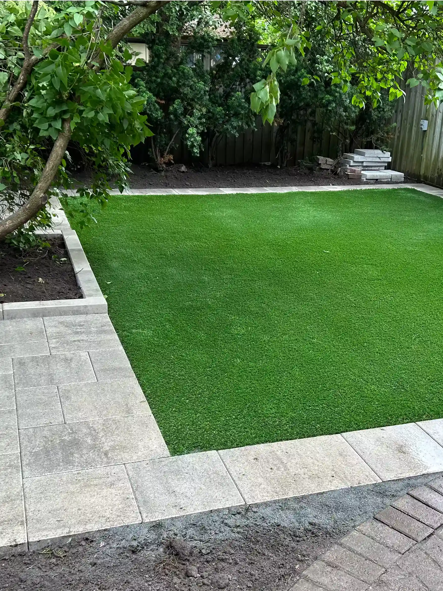 Professional Toronto artificial turf installation by UltraScape featuring proper drainage for a cleaner outdoor space